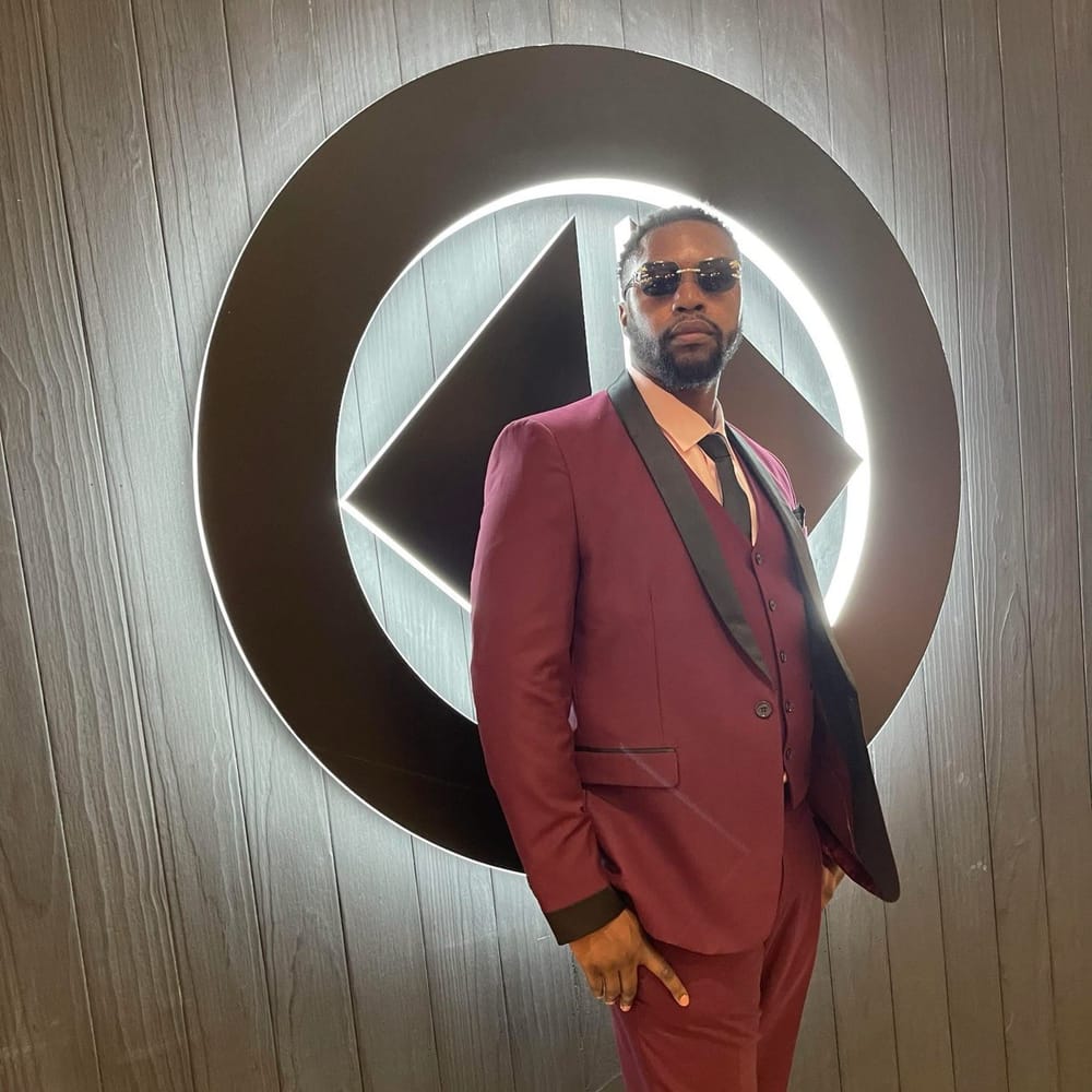 Shebastian Burley in a maroon suit at a Tampa Bay community event